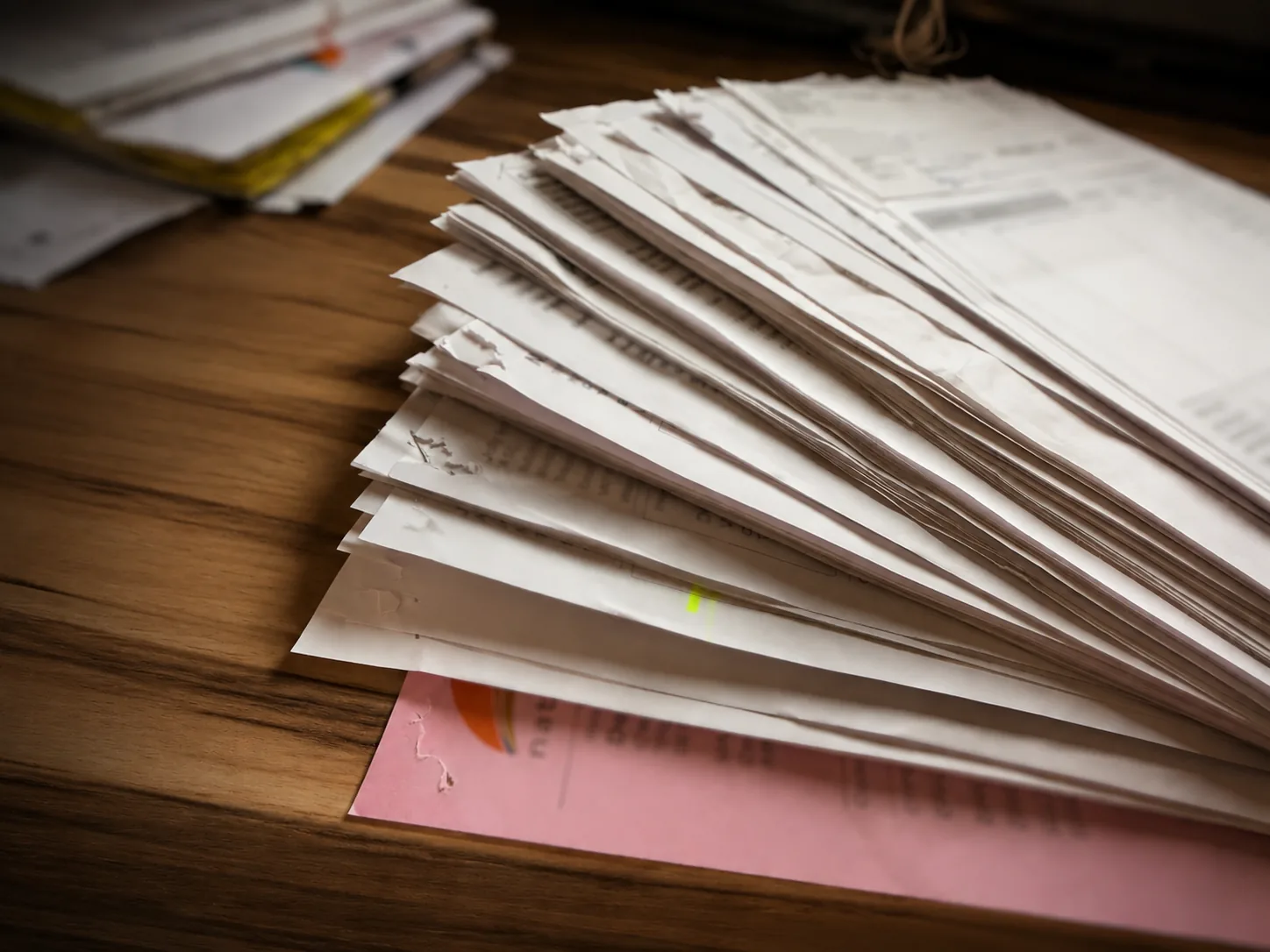 Stack of hospitality invoices ready for processing